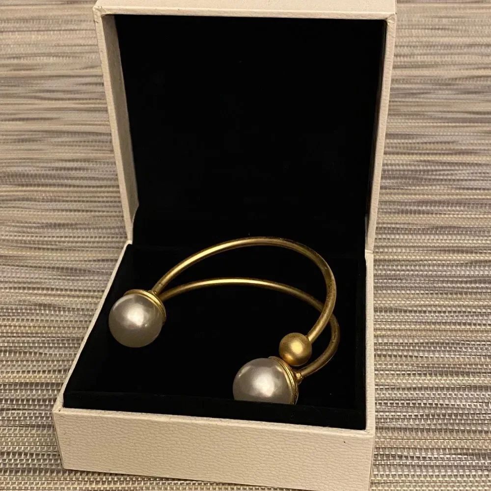Gold Tone Cuff Bracelet with Faux Pearl Ends